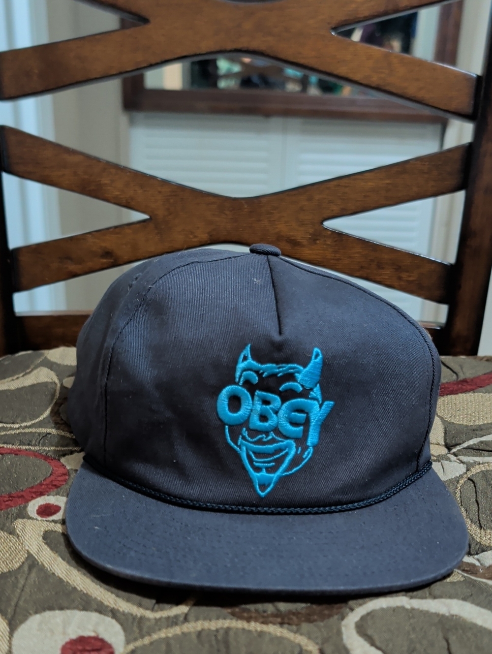 Obey Black Snapback Hat with Teal Devil Logo